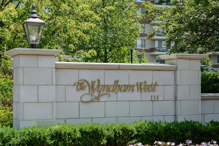 Indulge in the unparalleled lifestyle of The Wyndham, a prestigious condo community in the heart of the Village of Garden City. Elevate your everyday with a doorman, valet parking, clubhouse, cinema room, card games, indoor pool, health club, pond, barbecue area, and lush grounds. This end unit 3-bed duplex feels more like a townhouse, boasting a spacious entry, grand living and dining spaces with breathtaking views of the patio and greenery. The bright country-sized kitchen is perfect for holiday meals. The primary en suite, with a dressing area and walk-in closet, and a secondary bedroom with an en suite and ample closet space, exemplify luxury living. Enjoy the convenience of a laundry room with a washer/dryer, a new second-floor guest bath, and an ADA-approved first-floor full bath. With two garage spots, experience the best The Wyndham has to offer & make this your new home!