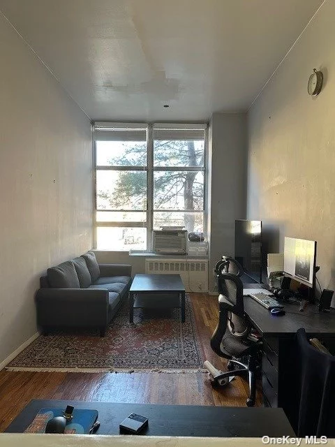 One bedroom condo in the heart of Woodside. High ceilings, hardwood floors, efficiency type kitchen with open layout into the living room. Large windows that project plenty of natural light. Walking distance to # 7 train, LIRR, public transportation. Easy access to La Guardia Airport and BQE. The area boasts restaurants from different cuisines.