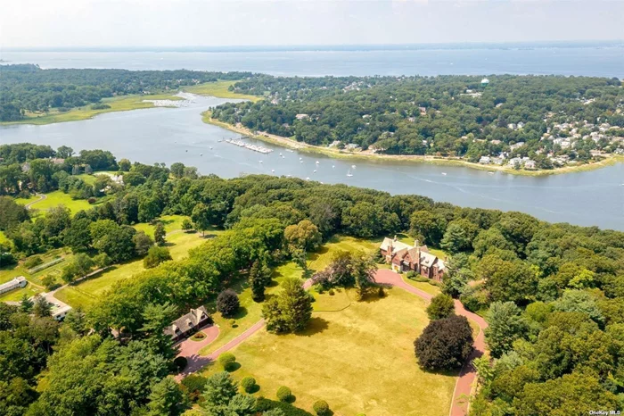 A 12 Acres of Waterfront Land with Multiple Cottages and Pools on Property. The land is 450ft facing Mill Neck Creek. A FABOULOUS BUILDABLE LOT FOR ANYONE LOOKING TO BUILD THEIR DREAM HOME!