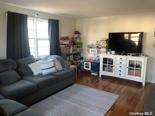 Beautiful first floor apartment. Features include: A spacious living room, tastefully renovated eat-in-kitchen, updated full bathroom and 2 spacious bedrooms, partially finished basement with laundry room and off street Parking. Conveniently located to transportation, shopping and Manorhaven Park.