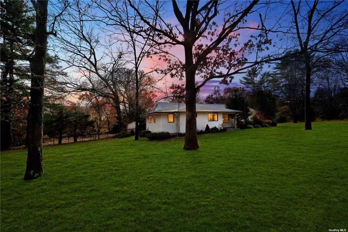 Village of Laurel Hollow, Newly renovated Expanded 4 Bedroom Ranch on picturesque 2 acre Property. Spacious, Sunfilled, Main Living Area with Open Layout. Features Large LR with Sky High Vaulted ceilings, Formal Dining Room, Large Custom Kitchen with Top of the Line, Appliances (Wolf, Bosch, Fisher Paykel) Large Pantry. Master Bedroom With Lofted Ceiling, En Suite Bath with Soaking Tub, Walk in shower, Toilet closet with Bidet, Dual sinks, Walk in Closets, Private Balcony. 2 Bedrooms with Jack and Jill connecting bathroom, Large 4th Bedroom suite/guest quarters with private bath, Main level laundry Center with Washer/Dryer included, folding area and storage, Entrance to Spacious 2 Car Attached Garage, Large Unfinished Basement,  2nd Refrigerator/Freezer, Storage. Whole Home Renovated 2019, Including: CAC, heating, Domestic Hot Water, windows , Siding , Doors, Floors, Azek Deck with Built in Kitchen and Seating. Built in Gunite Pool , Cold Spring Harbor Schools. The Best that Main Level living Offers!