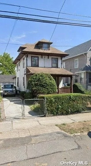 4 bed 1.5 bath spacious  colonial with a walk up attic and a basement with high ceilings located in the heart of Far Rockaway.Close to transportation and shopping .