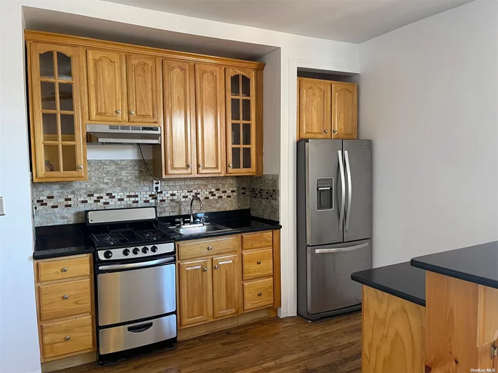 Welcome to this bright and updated 1 bedroom CoOp, conveniently located in the heart of Richmond Hill near beautiful Forest Park. It is close to public transportation, shopping, schools, and the subway. Open concept Kitchen with Granite Countertops and Island for two. Stainless Steel Fridge & Stove are 3 years young! Bathroom has been recently updated. There are Hardwood Floors throughout. Nice size bedroom with Plenty of Floor to ceiling Closets. This building is Pet Friendly and Subletting is allowed. No Flip Tax!!! The building is in a beautiful tree lined Residential Area.