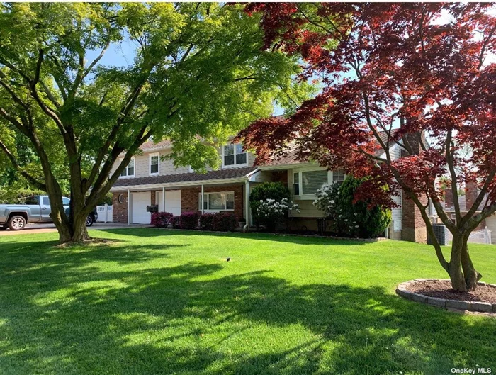 Stunning and Unique Split Level Home. Completely Renovated with Open Concept Living. Entry Foyer Leads to Formal Living Room and Dining Room. Large Sunroom Completely Surrounded by Windows w/Kitchenette and Sliders to In-ground Pool. Breathtaking Gourmet Eat in Kitchen w/High End Stainless Steel Appliances, Oversized Island w/Prep Sink and Vaulted Eating Area w/Skylights and Accent Wall w/Pellet Stove and Radiant Heat Floors. A Few Steps Up Leads to Primary On Suite w/Vaulted Ceilings. Primary Bath Includes Standalone Tub, Double Sinks and Stall Shower w/Dual Rain Shower Heads and Body Sprays and Radiant Heat. 3 Additional Bedrooms, Main Full Bath w/Double Vanity and Radiant Heat. Lower Level Includes Laundry Area, Powder Room, Work Out Area, Utilities and Walk Out. Stunning Backyard w/In-ground Pool, Built in BBQ w/Gazebo. 2+ Car Attached Garage. Double Driveways. Great for Entertaining An Absolute Must See!!!