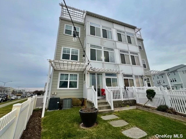Stunning duplex apartment in Arverne by the Sea, located directly across the street from the beach! This apartment is on the 1st and 2nd floor of the townhome. It comes fully furnished with an open-concept kitchen, living room, dining room, and a porch where you can enjoy the ocean breeze. There are three bedrooms, two bathrooms, plenty of closet space, an in-unit washer/dryer, permitted parking, and a lovely backyard to entertain. Conveniently close to all transportation to Manhattan, local shops, restaurants, and the YMCA. The tenant pays for gas and electricity.