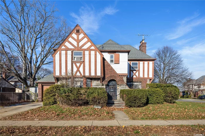 Discover the timeless charm of Tudor elegance Situated on a corner lot, nestled in a sought-after location in Mineola, this 3-story Tudor-style home with a fully finished basement offers both character and convenience. The first floor boasts three spacious rooms, a well-appointed kitchen, a formal dining room, a cozy living room, and an inviting foyer-all adorned with high ceilings, original solid wood doors, and gleaming hardwood floors. Upstairs on the second floor, find your sanctuary in the master bedroom, along with two additional bedrooms, while the full bathroom provides both a bath and shower. The attic on the third floor offers versatile usage and ample storage space perfect for a home office, playroom, or extra bedroom. Downstairs, the fully finished basement with high ceilings presents limitless possibilities for recreation or additional living space. This property is perfectly located near essential amenities, including the LIRR for easy commuting, a hospital, the bustling Roosevelt Field shopping center, and excellent schools.