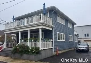 Spectacular Ocean views in this 2 bedroom, 1 bath upper unit. One house from the ocean on wide west end block, Open Lr-Da w/gas fplc., kitchen has big island, Cac, W/D, Parking, Front & back decks, amazing views, shared storage in garage.