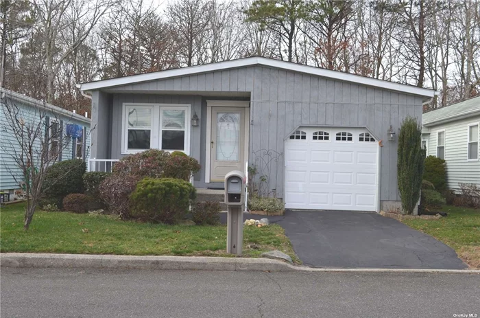 Welcome to your dream home in Manorville!! This immaculate 2-bedroom, 2-bath home is nestled in a secure, pet-friendly 55+ community with gated access. The eat-in kitchen boasts a brand-new refrigerator and microwave. The freshly painted interiors, the plush new carpeting as well as the updated primary bath make it move-in ready! The convenience of an in-unit washer/dryer enhances daily living. A private wooden deck offers a tranquil retreat, overlooking a scenic nature preserve. With a 1-car garage, this spacious residence is part of an active community featuring a clubhouse with a game room, a kitchen and a gym. Outside there&rsquo;s a pool, bocce, tennis and pickleball as well as a gazebo and an rv parking area. Enjoy the community van service for hassle-free trips to nearby shops, houses of worship and attractions. The community newsletter keeps you informed about activities and events. Ideally situated near major roads, shopping centers, outlets, wineries and the aquarium, this home is a gateway to comfort and convenience!!!