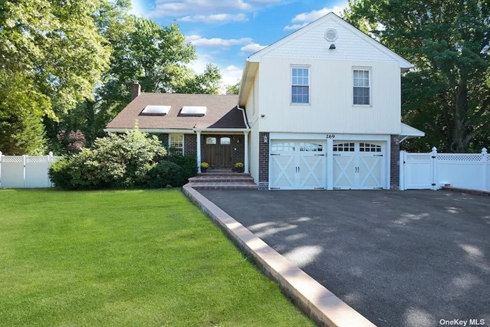 Step Right into the Double Door Front Entry to this Beautiful and Spacious Colonial Home. The Living Room with Vaulted Ceiling flows into the Dining Room for Easy Entertaining. The Updated Kitchen has SS Appliances, Granite Countertops and a Glass Sliding Door Leading to the Parklike Shy 1/2 Acre Grounds. A Large Family Room with Fireplace, Laundry Room, Powder Room and Access to the 2 Car Attached Garage Completes the Main Level. Upstairs Features a Large Primary Bedroom with en-suite Bathroom and a Junior Bedroom with en-suite Bathroom, plus 3 Additional Bedrooms and a Full Hall Bathroom. There is a Partial Finished Basement Recreation Room and Utility Room with Storage. Hardwood floors, High Hat Lighting, Updated Kitchen and Baths, Central AC and So Much More! Located near Beaches, Shopping, Schools and Houses of Worship.