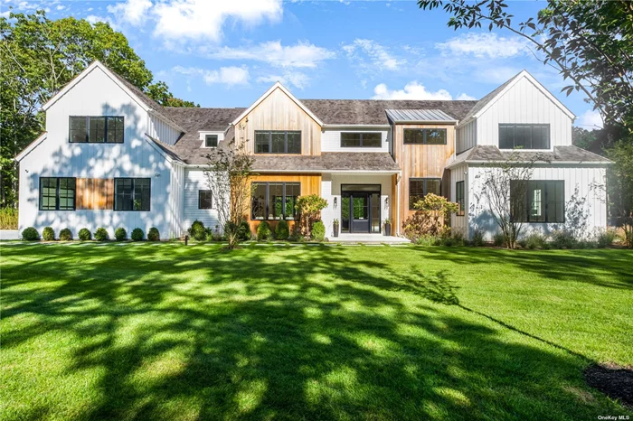 Sited on 1.9 acres in Sagaponack this brand-new construction home has it all: 9, 607+/ - sq. ft. with 8 bedrooms, 8 full and 3 half baths, finished lower level, heated gunite pool and spa, and sunken all weather tennis court. Enter to a double height foyer and open living areas with great room, eat-in kitchen and breakfast area with gas fireplace, opening to expansive covered rear Turkish marble patios, and a living room with fireplace, opening to a covered porch. A dining room is also on this level, along with a junior primary suite with walk-in closet, an attached 2-car garage, mudroom and powder room. Upstairs find the spacious primary suite including a luxe bath with shower, soaking tub and double vanity, two walk-in closets and large terrace. Four additional en-suite bedrooms are also on this level, one with private terrace, along with a sitting room. In the finished lower level find a terraced movie theater, full gym with infra red sauna, large recreation area, powder room and two more bedrooms sharing a bath. Outdoors entertain, dine al fresco or relax on the porches or patio, and enjoy the pool, spa, pool house with bath and kitchenette. Sunken all weather tennis completes the property. Located in the Sag Harbor School District, in easy reach of Sag Harbor Village, Bridgehampton and ocean beaches.