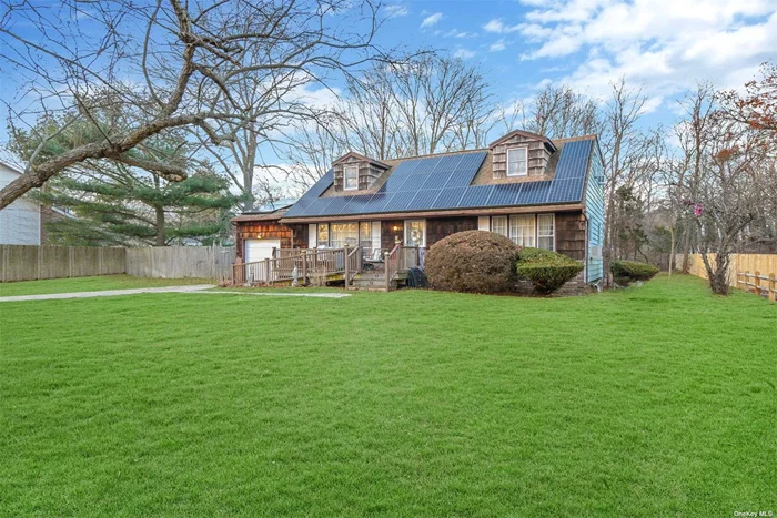 Welcome to this oversized center hall colonial/cape home, nestled on an oversized .57/acre just waiting for you to make your own! Needs some TLC, but has lots of space to work with! The replaced windows and single-layer roof in 2010 provide a sense of security and efficiency, along with the OWNED solar panels adding peace of mind provided by the Generac 11k BTU fully automatic propane whole-house generator - the two propane tanks will keep the house running for a full month! The attached garage, full poured concrete basement that is partially finished with an outside entrance to the garage, and enclosed sun porch add to the home&rsquo;s appeal. The kitchen is equipped with newer double electric wall ovens, a dishwasher, microwave, gas range, and a Bosch French door stainless steel refrigerator with a bottom freezer. The laundry/pantry closet conveniently houses an electric clothes washer and dryer on the first floor. The property has seen significant upgrades between 2015 and 2016, including an in-ground fully programmable lawn sprinkler system, an extra-wide English cobblestone Stampcrete driveway and back patio area, and a vast Trex porch spanning two-thirds of the front of the house. Located on a Dead End street and close to shops, highways, LIRR, & More! A Must See!