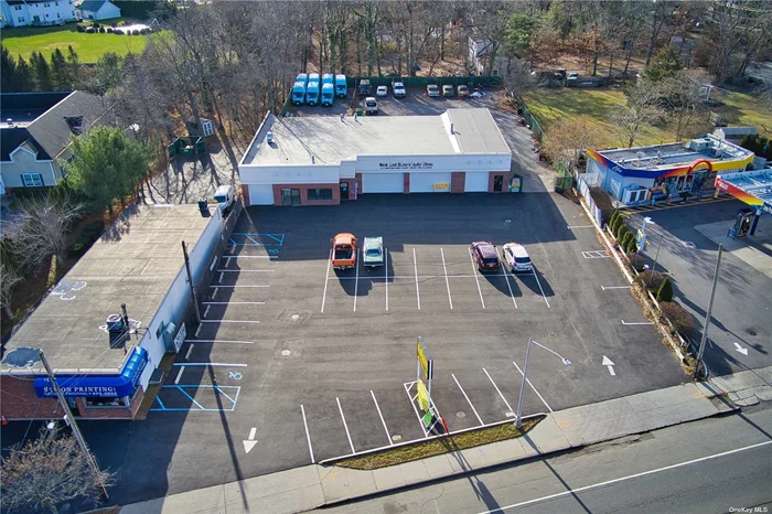 594 Route 25A is a 4 Bay Auto Shop. Front Over Head door is 10ft high, ideal for over sized vehicles. Lifts and Compressors in place. High Visibility on Route 25A. 33 Parking Spots in the Front with an additional rear lot.  New Facade and Paved Parking Lot. Usable 2400 SF
