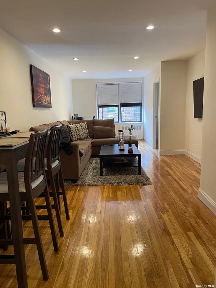 Stunning unit with beautiful hard wood floors and custom lighting throughout. The living room is massive, gorgeous kitchen cabinets and custom bathroom. This unit will not last. Board Approval required. Tenant pays electric and cooking gas. Laundry is in the building. Close to all shops and transportation.