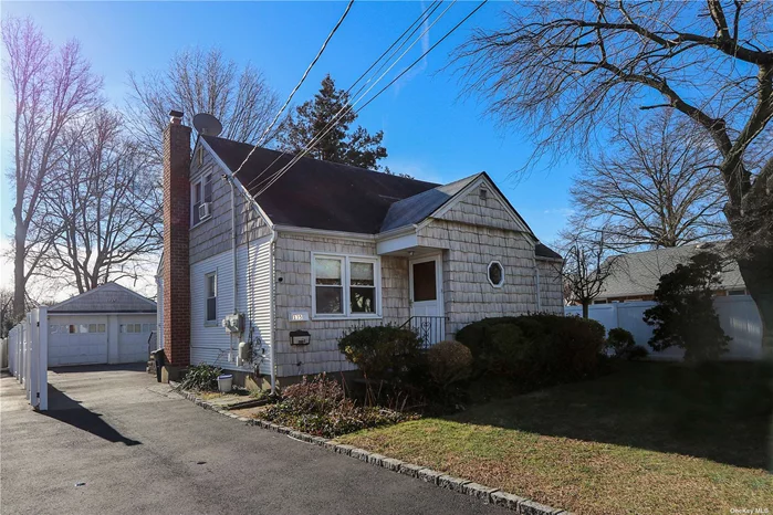 Charming two-family home in Glen Cove offering a perfect blend of comfort and convenience. The first floor boasts two bedrooms, a full bath, a spacious living room, and an inviting eat-in kitchen with an unfinished basement for additional storage. Upstairs, the second floor features one bedroom, a comfortable living room, an eat-in kitchen, and a full bath. The property includes a two-car detached garage, providing ample parking. Enjoy proximity to parks, shopping, restaurants, and schools.