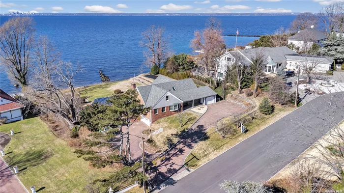Imagine waking up to bright magnificent water views and ending each day with a beautiful orange glowing sunset! 16 Whitney Circle is direct waterfront on the LI Sound and has 155&rsquo; of private beach connected to a larger beach perfect for strolling and finding sea glass. This 4/5 bedroom home was totally renovated and rebuilt in 2014 with vaulted & tray ceilings, spacious rooms, bright open spaces and a gourmet kitchen with spectacular views! The backyard has a Long Island Sound facing solar heated pool, hot tub & professional perennial gardens sitting on 1 acre of property.