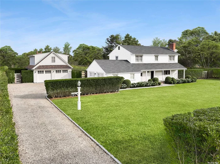 Located down a quiet cul-de-sac lane in the bucolic hamlet of Remsenburg, this classic Hamptons Farmhouse stands tall on a privately hedged acre, fully fenced and beautifully landscaped. A bluestone walkway welcomes you to the main home, originally built in 1967, most recently renovated in 2017. The well-appointed brick & bluestone front porch, overlooks the vast front yard, where you can sit and sip your morning coffee. The traditional layout includes 4 bedrooms, 3 baths, offering all entertaining on the main level, including an eat-in-kitchen, dining room & living room w/wood burning fireplace & den. Second floor boasts all bedrooms, with ample closet space, immaculate and pristine, including the primary ensuite with walk-in closet. As an added bonus there is an attached 2-car garage & full basement for storage. The home has undergone an extensive renovation including multiple upgrades, all new cedar shingle siding, asphalt roof, all new Anderson windows, CVAC, and a new oil tank. In 2020 the detached pool house was built with an additional 2 car garage, full bathroom, studio space on the second level for an oversized office or gym opportunity, plus, separate electrical service & generator. Amidst the many upgrades, the grounds have been entirely transformed, the rolling lawn encompasses a Madras Grey Limestone patio surrounding a heated saltwater glass bead gunite pool & spa. Relax and enjoy the surroundings underneath the trellis & outdoor fireplace for the perfect evening. An outdoor shower completes this package, making this unique opportunity something you will not want to miss, all located adjacent to 1.36 acres of preserved land owned by the Town of Southampton. The option to expand the main home up to 6 bedrooms is another possibility, as the cesspool has also been upgraded. Take a ride into Remsenburg and come see what it&rsquo;s all about!
