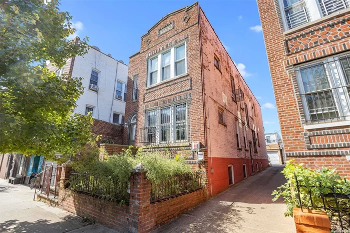 Beautiful 2 dwelling brick house, close to Northern Boulevard. Finished basement, driveway and garage with space for three cars. Close to shopping, restaurants, and buses. Easy commute to NYC.