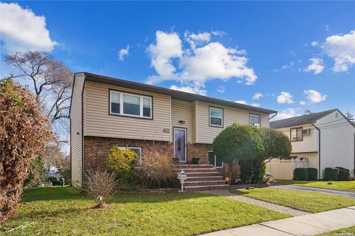 Take advantage of this beautiful split level mother and daughter set up. Perfectly located a few minutes the famous Nautical Mile and only 35 minutes to Penn Station and Grand Central on the LIRR. This property features 5 oversized bedrooms a wrap around kitchen, which makes it prefect when entertaining family and guest. The 2 full bath are strategically located one on each level. The half grass and half concrete back yard makes it prefect for a bbq. Looking for extra space? Check out the attic along with the garage, which has enough space for your car and storing all your tools. Take advantage of the lower rates and the shortage of properties on the market. This won&rsquo;t last