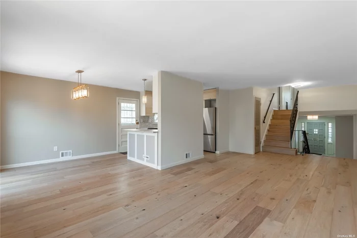 Totally renovated bright spacious Triplex. Living room, dining room, Eat in kitchen, 3 Bedrooms, 2.5 new bathrooms, new floors, freshly painted , new CAC units, sliders from Dining room triplex to yard for entertainment and basement. 1 car garage with access to 1st floor.