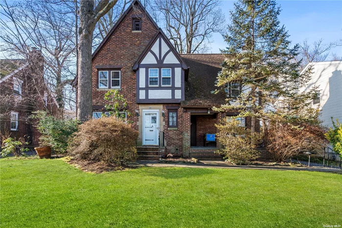 Rare brick tudor with all large rooms and bright natural light! Large eat in kitchen, magnificent den with high ceilings and walls of glass, as well as formal living room with fireplace. Quiet street with no through traffic, mid block, close to Allenwood Park and transportation. Over 2600 square feet.