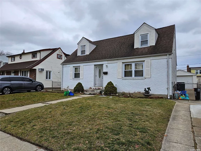 Spacious Cape Sitting on a 50x100 Lot, with Private Driveway and 2 Cars Garage, 4 Bedrooms and 2 Full Baths, Finished Basement with Laundry Area, Hardwood Floors Throughout, Huge Backyard!!!!! Close to Public Transportation, Shops, Etc