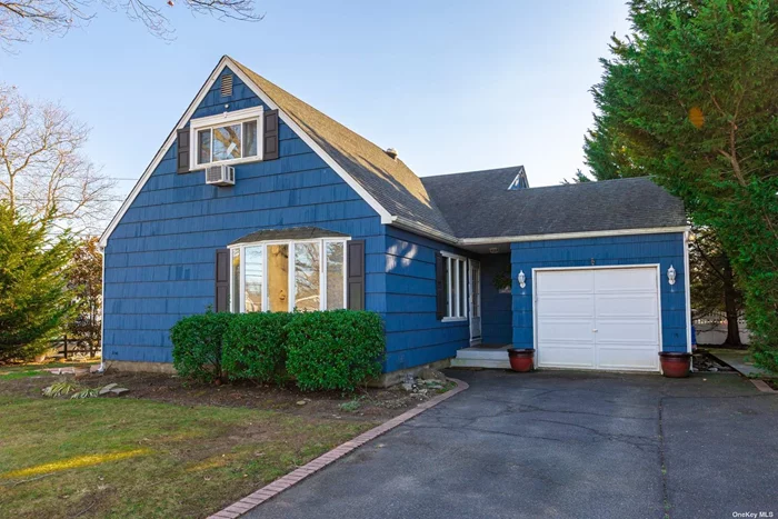 Welcome to this Picture Perfect Charmer in The Heart of The Village. This Split level home is situated on a large corner lot and brings in a ton of Natural light. The first level of the Home has an Updated Kitchen with Granite Counters and Stainless-Steel Appliances, a large living room and a formal dining room which both have gorgeous wood floors. The Sliding door from the dining room brings you to the tranquil Side Patio. The Second Level has 2 Nice Size Bedrooms & Full Bath. The third level brings you to the large Primary Bedroom which has Attic Space & Storage. The Lower level is the perfect Den/family room, second full bath or can be used as a studio apartment with the proper permits. There is a separate outside entrance. The awesome Private Deck is Perfect for Entertaining. 1 car attached garage and a large driveway that accommodates at least 5 cars are some other standout features! Close to Village Shops & Transportation!