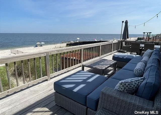 In this Luxurious home, you&rsquo;ll have front-row seats to some incomparable Long Island Sounds sunsets. Sit on the large deck or sit directly on the beach for one-of-a-kind views. Or simply dip and relax in the hot tub and admire the view of the water. This 4-bedroom beach house sleeps 12. The master bedroom with a King bed and one of the Queen bedrooms has its own access to the balcony. The open floor concept allows you to move around the kitchen. The home also comes with central air/heating. There is a sunroom with wrap-around windows where you can have a spectacular view of the ocean from sunrise to sunset. A river rocks fireplace is always ready during cold nights and/or wintertime. You can also enjoy outdoor dining with an outdoor BBQ grill or have dinner inside in a large dining room that seats 12! Have a great time and have fun in the game room on a pool table, a foosball, and an air hockey table. You are guaranteed essential amenities including free parking, WIFI, and cable TV. Nearly all of our homes also come with kayaks to keep adventure close by. You are free to explore local destinations including the vineyards for wine tasting, farm stands to support local growers, a close-knit beach community, and nature reserves to explore. The five-star restaurants are minutes away as well as the Hamptons, Greenport, Montauk, and/or Shelter Island.