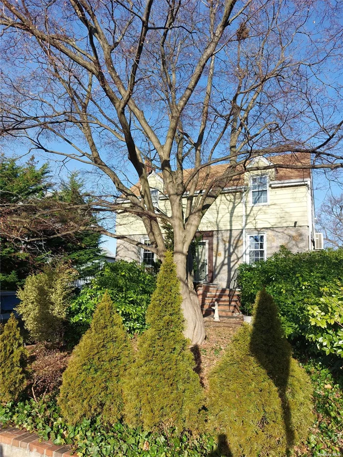 Classic Bayside North Center Hall Colonial. Set back and above the street. Featuring an abundance of natural light due to the property&rsquo;s southern exposure. Hardwood flooring on the first and second floors. Built-ins, crown molding, cozy fireplace, a heated sunroom as well as a powder room are highlights of the first floor. Three Bedrooms with large closets and a full bath with jetted tub are on the second floor. The lower level offers a large family room, half bath, and a full laundry room. Extremely convenient location!!! It&rsquo;s just a short walk to Crocheron Park, Littleneck Bay, Bell Boulevard dining and The Bay Terrace shops and entertainment. The Bayside Station of the LIRR is just a 6-minute walk and can whisk you to either Penn Station or Grand Central Station in no time. Located on a super quiet, small village feel, residential block. There is NO competition at this price point.