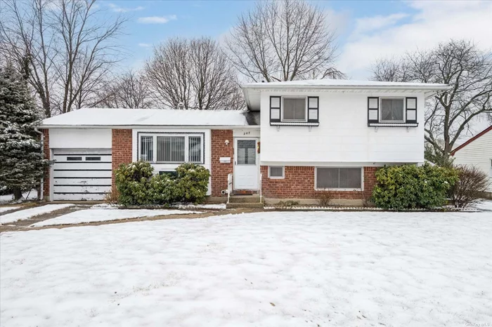 Welcome to 247 W. 23rd Street. 4 Bedroom 1.5 Bath Split Level Conveniently Located to All! Great Potential to Make This Your Own. Central Air, 1 Car Attached Garage. Not to be Missed!