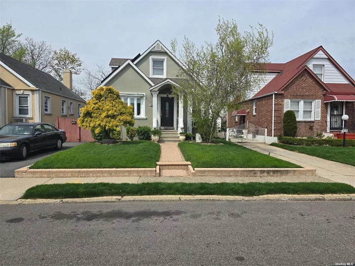 BACK ON THE MARKET WITH THE GREENEST LAWN ON THE BLOCK. Fully Renovated 4 Bedrooms, 2.5 Baths in the Heart of CAMBRIA HEIGHTS. Full finished basement with Family room, laundry and storage. 1 car garage with room for 3 cars in the driveway. A MUST SEE.