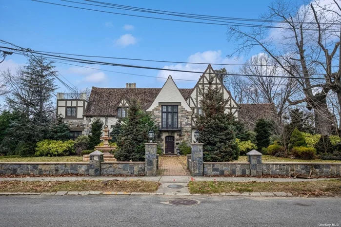 Magnificent and majestic renovated English Tudor in the heart of Jamaica Estates. There is no other property like it in Jamaica Estates(north). A true one-of-a-kind property. This breathtaking property with a huge enormous and sprawling 23, 664 sqft lot is surrounded by a stone wall that has exquisite curb appeal. This breathtaking house introduces on the lower level a full bath, gym, sauna, and steam room. The first floor introduces a large foyer with soaring cathedral ceilings, beautiful wood floors, a 1/2 bath, a large living room, a huge formal dining room, 2 dens, a beautiful sculpted fireplace, and a stunning custom-built eat-in kitchen which includes, a Subzero refrigerator, Viking stove, wolf stove top, granite countertops and top of the line cabinetry The second floor introduces 5 large and majestic bedrooms, each with a full bathroom. The master suite has a beautiful wood-burning fireplace. The third floor introduces a large sweeping bedroom. This superb property includes beautifully landscaped gardens, flower beds, shrubbery, and a cobblestone patio.2 car attached garage and 2 car detached garage.
