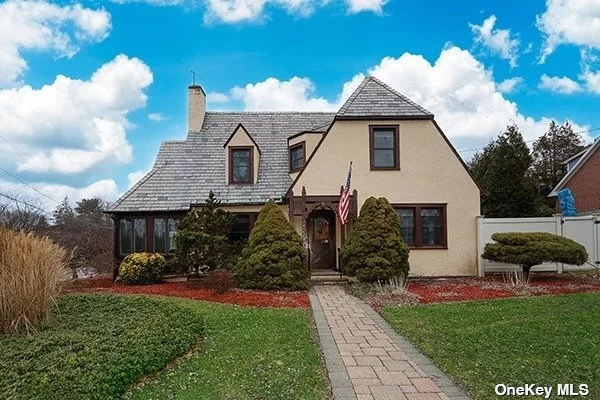 As Spring approaches, seize the opportunity to own this meticulously crafted Stern Living home in Glen Head&rsquo;s Hill Terrace. This elegant center hall colonial Tudor-style home showcases 4 bedrooms and 2 full baths accentuated by gleaming hardwood floors. The heart of the house, an expansive kitchen, boasts granite countertops and modern stainless steel appliances. Enjoy the warmth of a wood-burning fireplace in the Living room that flows into a bonus heated sunroom. The allure continues with a full walk-out basement leading to a paved outdoor haven; complete with in-ground pool, heated spa, and a fantastic outdoor kitchen featuring a BBQ, sink, and refrigerator for year-round entertaining. Award-winning North Shore schools, proximity to town, shops, restaurants, LIRR, bus, and easy access to major roadways make this home an irresistible gem. Don&rsquo;t miss the chance to make it yours before it disappears from the market!