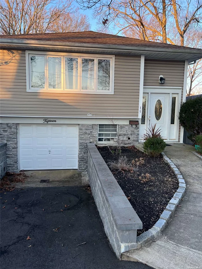 This is a beautiful, very well maintained high ranch home. Roof and siding is 10 years old. New boiler.Updated electrical system. Energy efficient LED lighting. Gas heating and cooking. Nice long driveway. Lower level is completely finished. Close to shops, restaurants, take-out. LIRR also located close by. low taxes.