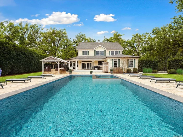 As you arrive at 32 Jagger Lane in Westhampton, you are instantly enamored by this gorgeous south of the highway traditional home the moment you see it. From the spacious circular driveway to the landscaped grounds, and from the inviting front porch to the barn in the backyard, everything about this home has been meticulously cultivated in order to create the ideal Hamptons Luxury home. Built and owned by revered Sea Level Construction owner Anthony Bonner, this beautiful home boasts a formal living room, den with coffered ceiling and fireplace, Chef&rsquo;s eat-in kitchen with granite countertops and stainless steel appliances, formal dining room, spacious Primary En-suite, a lovely Junior En-Suite bedroom, and two well appointed guest bedrooms. Additionally, 32 Jagger Lane offers a heated Gunite pool with hot tub, Mahogany deck, outdoor shower, Tiki Bar, finished basement, security and sprinkler systems, central vac and central air systems, attached two-car garage, barn with entertainment space, and so much more. Located just outside Westhampton Beach Village, this home is truly one of a kind!