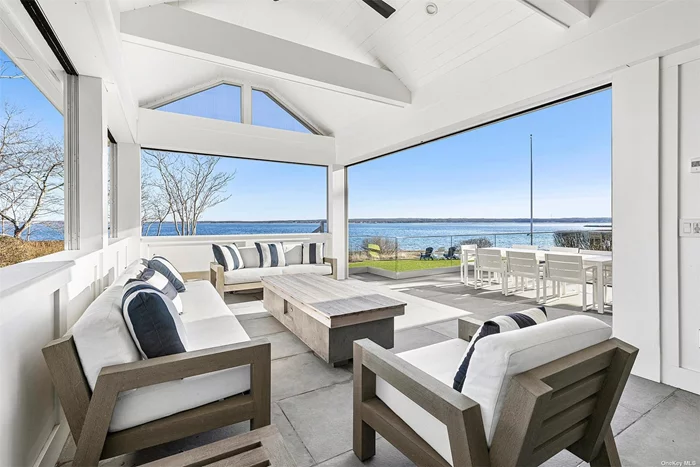 Discover the charm of Aquebogue, NY, with our newly renovated beachfront retreat. This stunning home sits directly on the bay, offering a heated pool surrounded by a bluestone patio and an inviting gas fire pit-perfect for memorable family gatherings. This modern, immaculate home boasts direct beach access, encouraging morning kayak trips in the Great Peconic Bay and quiet exploration of shores and coastline. Finish your days with cocktails on the lawn while watching boat traffic slide across the bay. The house features an elegantly appointed primary bedroom complete with a balcony overlooking the bay and a luxurious ensuite bath. Accommodating guests comfortably, there are three additional bedrooms and 2.5 more baths, ensuring ample space for everyone. Work from home with solid internet and a comfortable office with water views. Positioned on the beautiful North Fork, this property is an ideal starting point to experience the region&rsquo;s allure, from its lush farmstands and distinguished vineyards to a wide array of dining options, ranging from fine to casual eateries. Embrace the opportunity to live in a slice of paradise, where luxury meets the tranquility of beachside living.