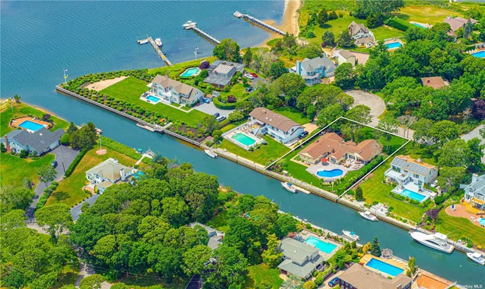 Located within the exclusive Old Harbor Colony Community in Hampton Bays, this stunning waterfront property offers a picturesque escape with luxurious amenities. Boasting 120 feet of bulkheading on a scenic canal, the residence features a 50-foot dock, providing the perfect setting for boat enthusiasts and water lovers. The expansive home, thoughtfully designed with a focus on comfort and functionality, includes a total of five bedrooms including a well-appointed in-law suite, offering versatile living arrangements. The main living space includes a primary suite, featuring a spacious walk-in closet for added convenience and two additional guest bedrooms. With a private entrance, enjoy seamless living in the separate guest wing equipped with two bedrooms and a summer kitchen. Step into the heart of the home, where an open floorplan seamlessly integrates the kitchen and living room, creating an inviting space for both entertaining and everyday living. The kitchen is equipped with modern appliances and ample counter space, making it ideal for culinary enthusiasts. Beyond the interior, the property&rsquo;s grassy backyard is a private oasis, complete with an irrigation system to maintain the lush greenery. This meticulously maintained residence not only offers a comfortable and stylish living environment but also provides access to the tranquility of waterfront living in one of Hampton Bays&rsquo; most coveted communities. Step outside to discover a private oasis with ample shaded areas around the pool, a two-car garage, and an outdoor shower for added convenience. The meticulously designed landscape is enhanced by Lexor lighting, creating a sophisticated ambiance. The property is equipped with a Sonos sound system, providing seamless audio enjoyment indoors and outdoors. This residence offers not only waterfront living in a coveted community but also a lifestyle marked by comfort, convenience, and modern luxury.