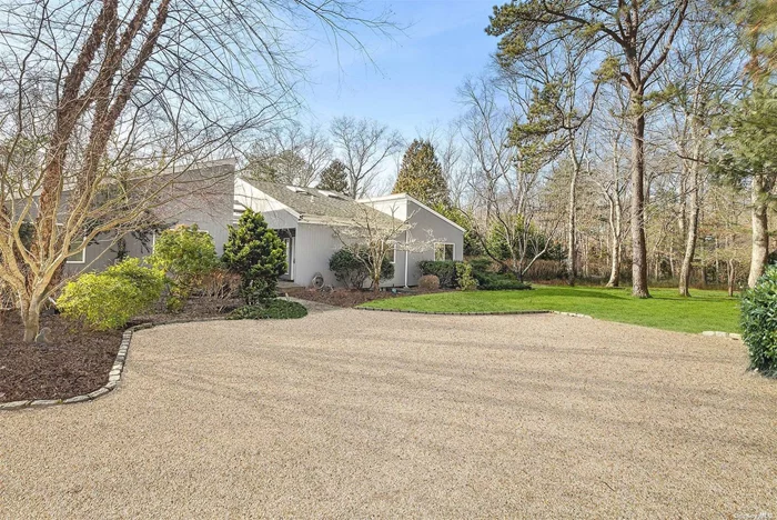 This 5 bedroom, 4 bath contemporary residence in Ice Pond Estates, Quogue, was renovated to perfection in 2017. Located within a beautiful neighborhood overlooking the Quogue Wildlife Refuge, this property offers easy access to hiking trails, Quogue Village amenities, shopping, ocean beaches, and numerous golf courses. The open floor plan features 3, 088+/- sf of living space, a spacious great room with soaring ceilings, a cozy fireplace, and oversized windows that engulf the space with natural light. The great room seamlessly flows into the dining room, high-end kitchen, and den, creating a wonderfully envisioned space perfect for both entertaining and relaxation. The lower level of the home is partially finished and offers a media room with a wet bar, a bedroom, and a bathroom. The meticulously landscaped 0.92+/- acre grounds feature a spacious deck with a heated pool, perfect for entertaining, and an outdoor shower. A fantastic opportunity not to be missed. With its prime location, luxurious features, and meticulous attention to detail, this property is a perfect place to call home.