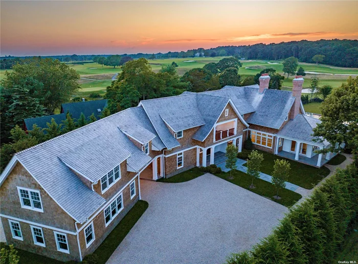 Located in the heart of Amagansett, this stunning new construction estate is sited on a 1.3 acre fully cleared property, with sweeping elevated views of the South Fork Country Club. Designed by storied architecture firm Fleetwood, McMullan & Sanabria and built by renowned local builder Phil Kouffman, this generational estate offers 12, 395+/- square feet of elegantly appointed living space spanning three levels with 9 bedrooms, 9 full and 3 half baths. Intentionally designed for open concept living, this home features multiple expansive sight lines with views over the perfectly manicured pool and bucolic grounds, creating an immersive setting that showcases the back-nine of the golf course. The home perfectly blends light-filled indoor living spaces with more intimate and private outdoor areas. Upon entering the 30 foot tall open entry foyer, one is welcomed by an architectural oak staircase and a wall of windows which flood the room with light, spilling into the adjacent dining room and grand living room with oversized fireplace and spectacular eat-in kitchen. All finishes throughout the residence are thoughtfully selected with the ultimate in design and quality in mind, including a premium marble package throughout the home, 8 wide European oak flooring and Waterworks fixtures. The Bakes & Kropp Fine Cabinetry kitchen is equipped with a Wolf range, dual side-by-side 36 Sub-Zero refrigerator/freezer units, dual Cove premium dishwashers, a built-in gourmet coffee machine, wine fridge and beverage center. The kitchen is centered by the oversized waterfall marble island with ample bar top seating and a more casual seating area. There is also an adjacent Chef&rsquo;s kitchen with a supplementary 6-burner Wolf range and dual ovens. A thoughtful breakfast nook that overlooks the magnificent grounds and golf course completes this sun-filled kitchen. The kitchen flows outside to a 1, 200+/- square feet partially covered terrace with ample room for al fresco dining and living. Additionally on the first floor, one will find a study, mudroom, powder room and a first-floor junior primary bedroom suite with walk-in closet and en suite bath. An elevator services all three levels of the home. The second floor offers breathtaking views of the golf course and features three graciously sized en suite bedrooms all with walk-in closets, plus a second-floor laundry room and a spacious library or sitting room. The deluxe primary suite has its own wing of the home, offering over 2, 500+/- square feet of serene private living space with sweeping views of the golf course. This grand suite is equipped with an oversized bedroom, dual primary baths featuring large vanities, a free-standing soaking tub and two spacious showers, dual walk-in closets, an office/sitting room and accompanying wet bar, 3 private balconies and a laundry chute directly to the lower level. The fully finished lower level is completed to the same exacting standard as the rest of the residence, with multiple open recreational rooms and sitting areas, a custom millwork wine room, a full bar with plentiful bar seating, a sunken golf simulator room, and a spacious theater. There is also an additional large laundry room and two en suite guest bedrooms. The Wellness Center and Spa is all-inclusive, featuring a full gym, octagonal wood sauna, steam room with full bath, and a changing room that opens to a private courtyard and the outdoor shower complex. The courtyard allows for ample natural light in the lower level while providing a separate guest entrance and exit. The grounds are complete with a lush, manicured lawn, designed by esteemed landscape architect Patrick Conlan, and well-appointed with a 50x23 heated gunite pool and raised spa with waterfall feature surrounded by an expansive patio and tree-shaded outdoor dining area. There is also a 2.5-car garage, porte-coch?re and ample parking. All this located moments from local farm stands, shops, restaurants and world famous ocean beaches.