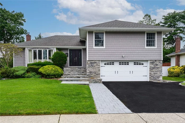 This stunning Split Level home is located in the heart of Syosset and offers an array of luxurious features and upgrades. Renovated in 2023 it surpasses new construction both inside and out. As you step inside you&rsquo;ll be greeted by an open layout that caters perfectly to entertaining. The all new European kitchen is a chef&rsquo;s dream, featuring a large center island with quartz countertops, built-in china closet and top of the line KitchenAid stainless steel appliances. Custom cabinetry and sliding doors lead to the backyard for a seamless flow between indoor and outdoor spaces. Throughout the entire home you&rsquo;ll find beautiful hardwood floors that add elegance and warmth. The dining area and kitchen extend to Trex deck balconies, offering additional space for outdoor dining and relaxation. Additionally there is a large den that provides yet another area for gathering and socializing. The full bathrooms have been completely remodeled showcasing quartz countertops, custom cabinetry and stylish light fixtures. Andersen windows throughout the home ensure ample natural light and energy efficiency. The finished basement offers a versatile space for recreation and storage with a generous amount of closet space, laundry area and utility room. The focal point of the property is the inviting inground gunite heated pool surrounded by a meticulously landscaped yard and complete with changing rooms or storage for added convenience. The home is equipped with a new washer and dryer for added convenience. From the outside the home exudes luxurious curb appeal with its stone and vinyl construction, professionally landscaped grounds and tasteful decor. Located in close proximity to shopping centers, LIRR, houses of worship and parks. This residence offers both convenience and comfort in an unbelievable location. Overall, this meticulously renovated home offers an exceptional blend of style and functionality, making it an ideal choice for those seeking a truly luxurious living experience.