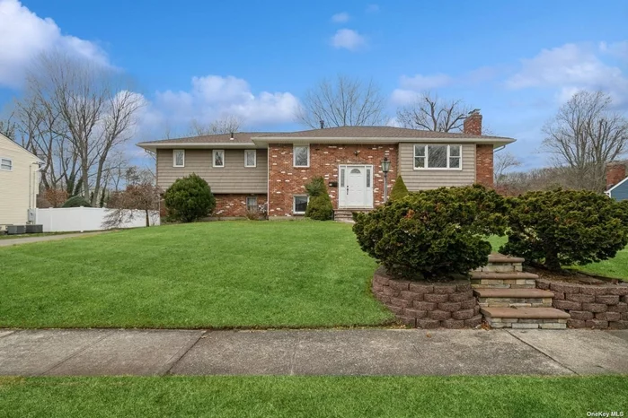 Dix Hills Beauty. Impressive Hi-Ranch with open floor plan and easy access to all. The second story outdoor deck beautifully looks over the large .34 acre yard. Gleaming Hardwood Floors and Abundance of Natural Sunlight and a two-car garage. Commack Schools. Tenant pays all utilities, ground care