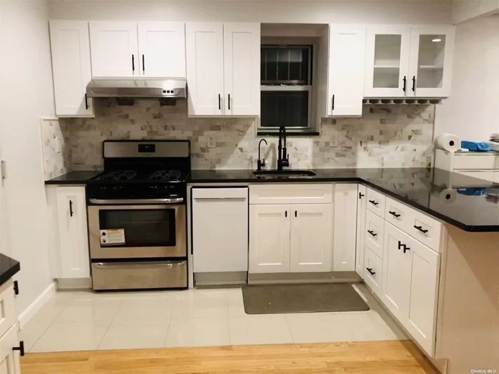 Welcome to this unique 1092 sf duplex condo in the heart of Elmhurst, but in the quiet residential street. currently featuring 2 BRs and 2 Baths, a large office, big balcony and above 300 sf backyard, perfect for gardening and entertaining guests. the entire unit has been recently renovated by seller: modern open kitchen layout, black granite countertops, beautiful white marble bathroom, hardwood floors, there are 2 separated wall unit ACs, washer & dryer, glass door separating the 2 floors, you will feel like living in a single family house minus the hassle of maintaining a house. easy access to M, R train station on Broadway, also Q53, Q58, Q60 bus station nearby. couple blocks away from Queens Place Mall, target, Costco. Supermarket, restaurant and shops nearby. buyers should verify all information independently.