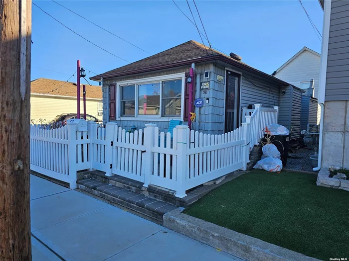 Excellent condition 2 bedroom, 1 full bath easy-living bungalow on quiet block in Inwood.  Flood insurance approximately $1200/yr and transferrable.