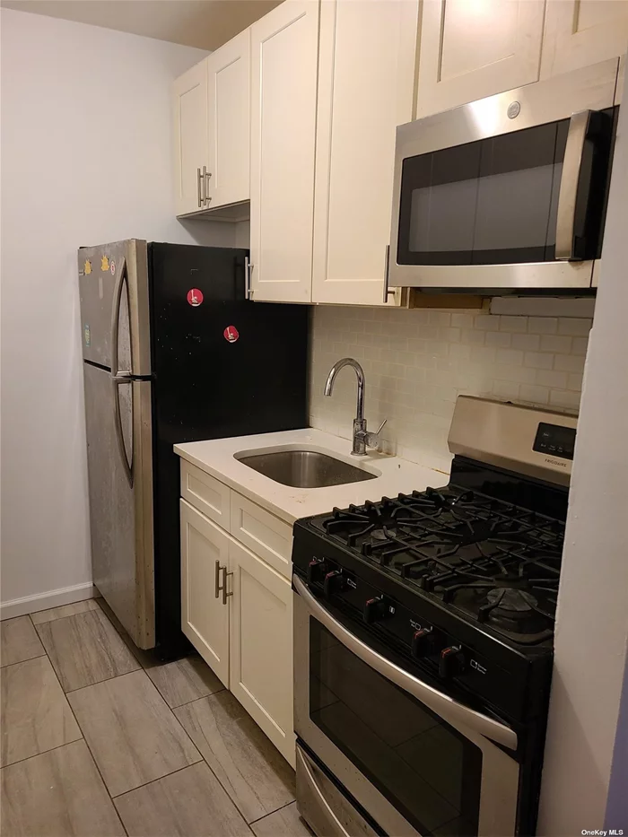 Renovated 3 bedroom duplex. Bright apartment with Pella windows, skylight, stainless steel kitchen appliances, hardwood floors throughout and tenants have full control over utilities. Conveniently located across the street from supermarket, bus stop, shopping, houses of worship and more!