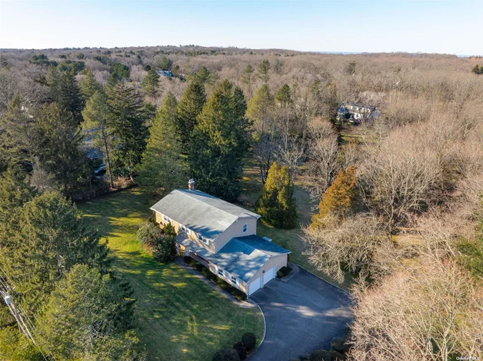 Welcome to this Traditional Center Hall Colonial situated in the Inc. Village of Laurel Hollow with private beach and mooring. The picturesque grounds offer two flat, private acres with plenty of room for pool/tennis. The Interior features include 4 bedrooms, 2 1/2 baths with formal living room, dining room, eat-in kitchen and family room with fireplace. The wood floors run through the first and second floors. This home with oversized windows offers beautiful natural light throughout and easy access to the property for entertaining. Laurel Hollow Beach (dues required) Cold Spring Harbor SD#2