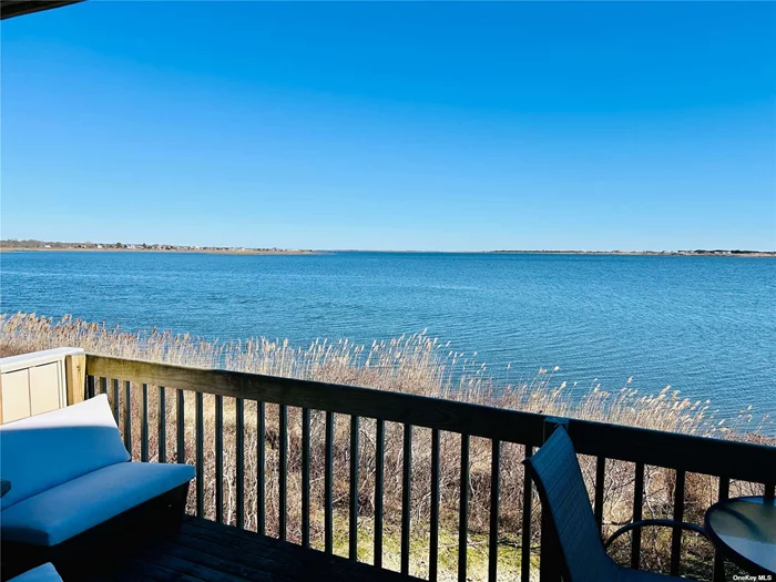 *WATERFRONT* LOW TAXES $5953.48 W/ OUT EXEMPTIONS- NEW FRONT STEPS COMING APRIL 2024 Absolutely Beautiful Townhouse Steps From Smith Point Beach Featuring Breathtaking Waterfront Views From Every Level. The First Floor Welcomes You With A Spacious Foyer Leading to Custom Kitchen, 1/2 Bath, Dining Area, & Spacious Living Room With Upgraded Pella Sliders And Deck Overlooking The Water. The Second Floor Boasts Luxurious Bedrooms, Each With En-suite Bathrooms. Master has Private Balcony For Enjoying The Serene Surrounding. The Third Floor Loft/Bedroom Is A Captivating Space Adorned With Skylights, Filling The Area With Natural Light And Warmth. With Its Versatile Layout The Loft Can Easily Transform Into A Serene Bedroom Retreat Or Office. The Ground Level Impresses With Its Marble Flooring, Adding A Touch Of Luxury To The Space. With Its Flexible Layout, This Level Serves As An Area That Can Be Utilized As Either A Bedroom Or Entertainment Space, Catering To The Diverse Needs And Preferences Of Its Occupants. Throughout The Townhouse, Updates Include High-end Finishes, And Designer Imported Fixtures, Creating a Seamless Blend Of Comfort And Elegance. Truly A Magnificent, Must See Property!!