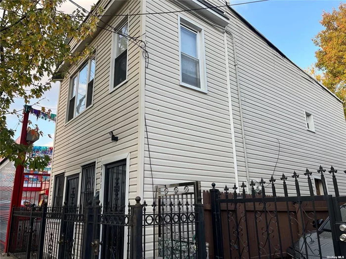DON&rsquo;T MISS! Welcome to this exceptional legal 2-family residence in the heart of Ozone Park-a versatile gem. Currently this legal 2-family residence is being used as a single-family home, this 2-family house presents a unique opportunity for a variety of living arrangements and investment possibilities. Positioned as a corner semi-detached property, the home has 2 separate front entrances, along with 2 separate electric meters. This property stands out with its R5 ZONING on a spacious 25x100 lot. The real highlight is the additional 1, 584 buildable square footage, offering the perfect canvas for expansion. Whether you&rsquo;re envisioning the addition of extra floors, more rooms, or a comprehensive extension, the possibilities are boundless. Upon entering the house, you&rsquo;re greeted by an open layout on the first floor, featuring a welcoming living room, a comfortable bedroom, full bathroom, and a separate entrance leading to the backyard. The thoughtful design provides both privacy and functionality. Venturing upstairs, the second floor unveils two generously sized bedrooms, creating an ideal space for family or guests. The open-concept kitchen with a pantry enhances the overall appeal, providing a central hub for culinary delights. The property&rsquo;s versatility extends to the fully partially finished basement, with a separate entrance. This additional space can be customized to suit your needs, whether as a recreation area, home office, or an independent living unit. Low taxes is an added PLUS, adding to its appeal as a smart investment. Act now and unlock the possibilities that await you in this gem of a property!