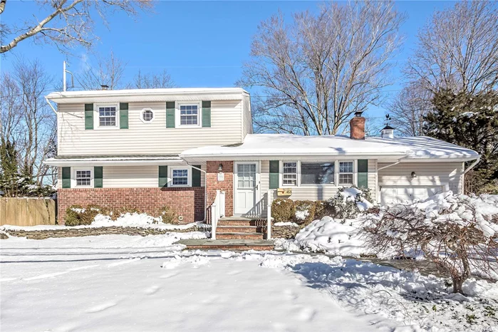 This bright and spacious colonial offers a rare opportunity in ideal North Syosset location. Boasting 5 large bedrooms, 2.5 baths, ample closet space, and a large basement with outside entrance, this residence is move-in ready! Home has been freshly painted, offers hardwood floors, a 1-car garage, and tons of natural light throughout. Gas heat, wood burning fireplace, PVC fencing all around, professionally landscaped, 10, 000 sq ft. lot. Convenient to LIRR, shops, restaurants. Syosset School District (Village Elementary/South Woods Middle).