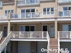 BEAUTIFUL 3 BEDROOM 2 BATH DUPLEX CONDO WITH PARKING 1CAR GARAGE & DRIVEWAY ACROSS FROM BEACH AND BOARDWALK OVER 1680 SF LOTS OF POTENTIAL, CLOSE TO SHOPS TRENDY RESTAURANTS, BARS AND LIRR 2 FIRE PLACES 3 BALCONIES AMAZING PROPERTY