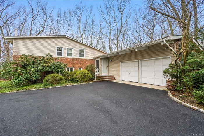 Nestled in the tranquility of a quiet cul-de-sac in East Norwich, this split-level home rests on a sprawling lot of 1.18 acres with a canopy of trees. Boasting 4 bedrooms and 3 bathrooms, this sunlit residence provides ample space and comfort. The main level features a spacious living room, a dining room ideal for entertaining, and a well-appointed kitchen with a breakfast area. The lower level family room offers an ideal space for relaxation and leisure. Enhanced by a new roof, siding, deck, driveway and CAC, this home ensures modern comfort and style. Complete with an oversized deck, perfect for outdoor gatherings and enjoying the picturesque surroundings. The property also features a full house generator, providing peace of mind. Conveniently located, this home offers easy access to schools, shopping, and major highways, ensuring a seamless blend of convenience and serenity. With low taxes, this is an opportunity not to be missed. Embrace the allure of this residence, where modern comfort meets natural splendor. 2 bedrooms and exterior lawn virtually staged.