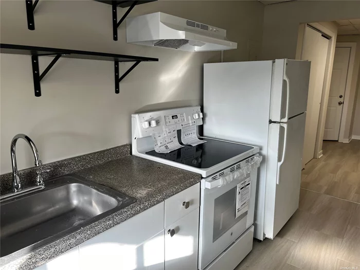 Bright and Airy Apartment in Westbury Village Overlooking Post Avenue. Completely Renovated with Laminate Floors and Gas Heat. Shared Private Rear Patio with Tenants at 2B. Close to LIRR, Buses, Parkways, Schools, Shopping, and All.
